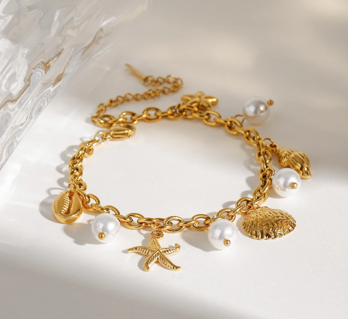 goldenes armband maritime charms wasserfest